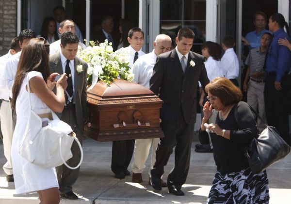 Photo by Trent Nelson  |  The Salt Lake Tribune

Pallbearers carry the casket at the funeral of George P. Lee, in Washington, Tuesday, August 3, 2010.