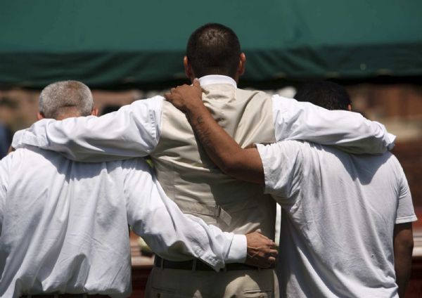 Photo by Trent Nelson  |  The Salt Lake Tribune

Family members embrace during graveside services for George P. Lee, in Washington, Tuesday, August 3, 2010.