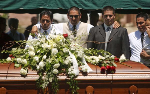 Photo by Trent Nelson  |  The Salt Lake Tribune

Sons of George Lee, left to right, are Scott Lee, Dwayne Lee, and Todd Lee as members of the Paiute tribe perform 