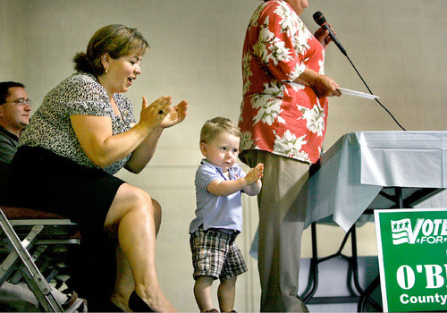 Scott Sommerdorf  l  The Salt Lake Tribune
California Congresswoman Linda Sanchez, left, applaudes along with her fifteen month old son Joaquin Sullivan after Maria O'Brien spoke at the roundtable discussion / summit about federal immigration reform with the public and the Utah State Hispanic Democratic Caucus at Centro Civico in Salt Lake City on Saturday.