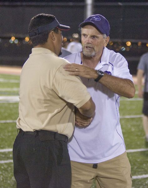 Paul Fraughton  |  The Salt Lake Tribune
Judge head coach James Cordova greets  Tooele head coach Ray Groth at the conclusion of their game.Judge Memorial played Tooele at  Judge on  Friday, August 20, 2010