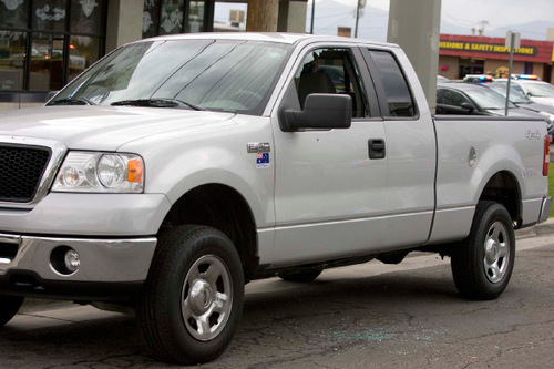 Paul Fraughton  |  The Salt Lake Tribune&#xA;&#xA;A Ford truck parked on the south side of 600 South just east of State Street has a shattered window and a bullet hole in the passenger door from a shootout. An officer was shot by an armed man who was shot and killed by the officer Friday near the Grand America hotel.