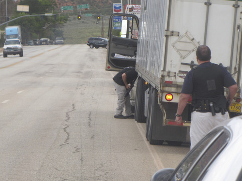 Mark Havnes  |  The Salt Lake Tribune
Law enforcement officials search a semi for man who allegedly shot a Kane County deputy. They did not find the man.