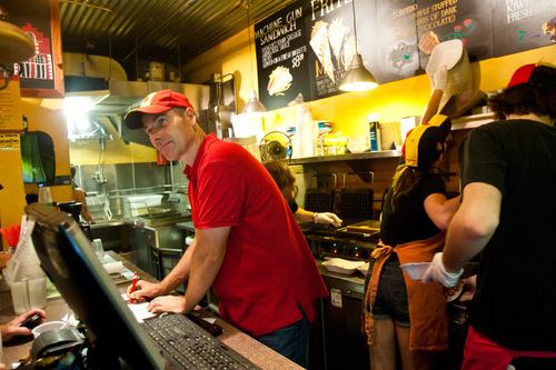 Chris Detrick  |  The Salt Lake Tribune &#xA;Pierre Vandamme takes orders for Belgian waffles at his cafe Bruges Waffles & Frites after the She and Him performance at the final Twilight Concert at Pioneer Park on Aug. 26, 2010.