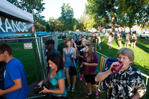 Chris Detrick  |  The Salt Lake Tribune &#xA;Concertgoers enter Pioneer Park before the She and Him performance at the final Twilight Concert at Pioneer Park on Aug. 26, 2010.
