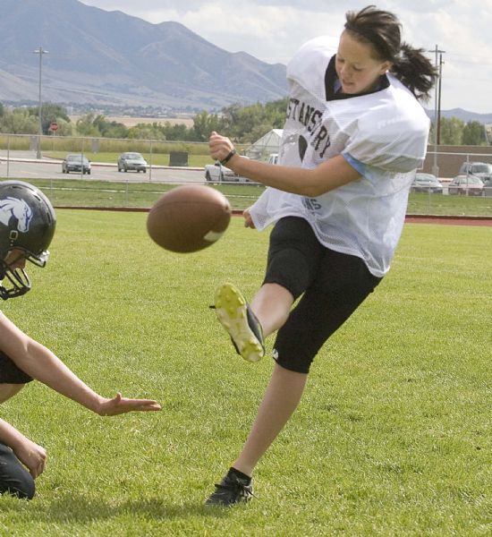 Paul Fraughton  |  The Salt Lake Tribune
Emily Lakin puts her foot into the ball at football practice.. She  is the kicker for extra points and field goal attempts inside the 25 yard line for Stansbury High School in Tooele County. Tooele  Monday, August 30, 2010