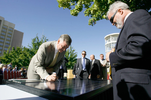 Leah Hogsten  |  The Salt Lake Tribune
Salt Lake County Mayor Peter Corroon, along with partners from NexGen Energy and Bella Energy, sign a solar panel after announcing plans to build the nation's largest rooftop array atop the Calvin L. Rampton Salt Palace Convention Center. The installation will cover 600,000 square feet and include more than 11,000 solar panels.