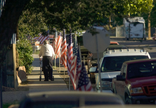 Steve Griffin  |  The Salt Lake Tribune&#xA; &#xA;Flags line the streets near Valley High School in Orderville, UT as people pay their respects during the viewing for Kane County Deputy Sheriff officer Brian Harris at  Thursday, September 2, 2010. Harris was killed in the line of duty.