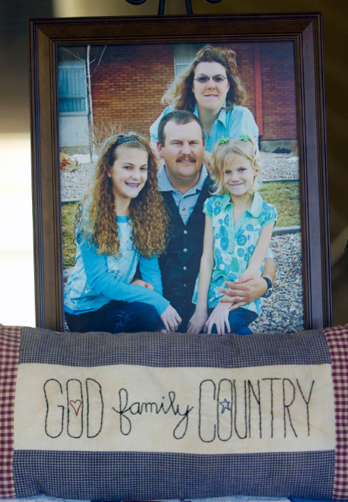 Steve Griffin  |  The Salt Lake Tribune&#xA; &#xA;Photo of Brian Harris with his wife Shawna Harris and children Kirsten and Kristina Harris was on display during the viewing for the Kane County Deputy Sheriff at Valley High School in Orderville, UT  Thursday, September 2, 2010.