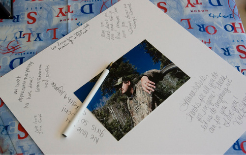 Steve Griffin  |  The Salt Lake Tribune&#xA; &#xA;People pay their respects with hand written notes during the viewing for  Kane County Deputy Sheriff officer Brian Harris at Valley High School in Orderville, UT  Thursday, September 2, 2010. Harris was killed in the line of duty.