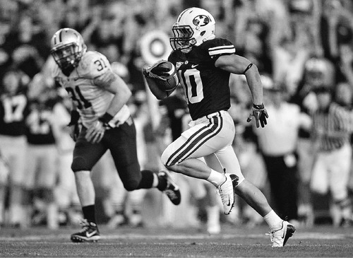 Trent Nelson  |  The Salt Lake Tribune
BYU's JJ Di Luigi runs for a touchdown in the third quarter. BYU vs. Washington, college football at Lavell Edwards Stadium in Provo, Saturday, September 4, 2010.