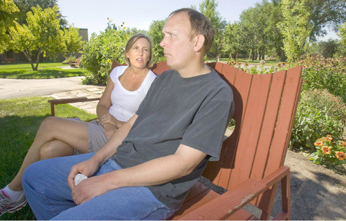 Paul Fraughton  |  The Salt Lake Tribune&#xA;Jenny Christensen sits in the gardens at the Utah State Developmental Center in American Fork with her younger brother, Philip Miller,  who was moving in to the center on  Wednesday, August 25, 2010