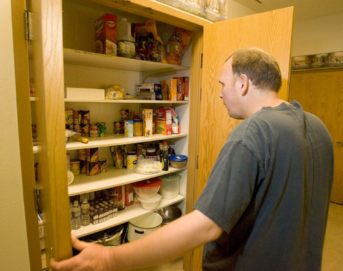 Paul Fraughton  |  The Salt Lake Tribune&#xA;Philip Miller, who is  severely disabled with autism, checks out the cupboards in his new apartment at  the Utah State Developmental Center in American Fork on  Wednesday, August 25, 2010