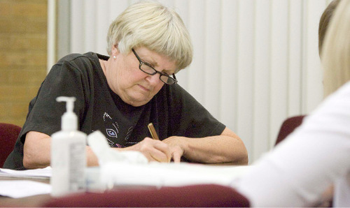 Paul Fraughton  |  The Salt Lake Tribune&#xA;Mary  Paulsen spent a good portion of the morning filling out paperwork concerning the care of   her son Philip, who is severely disabled with autism.  He was moving into the Utah State Developmental Center in  American Fork on Wednesday, August 25, 2010