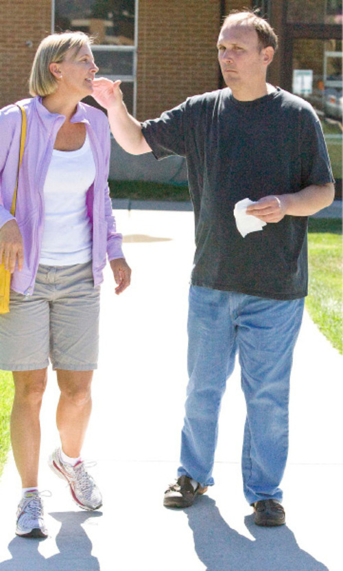 Paul Fraughton  |  The Salt Lake Tribune&#xA;Philip Miller and his sister Jenny Christensen stroll the grounds at the Utah State Developmental Center  as Philip becomes accustomed to his new surroundings on Wednesday, August 25, 2010