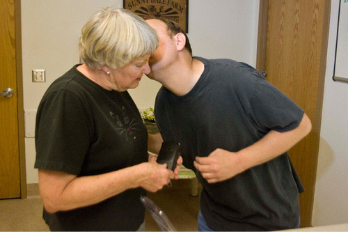 Paul Fraughton  |  The Salt Lake Tribune&#xA;Mary  Paulsen  gets a quick kiss from her son Philip, who is severely disabled with autism. He was moving into the Utah State Developmental Center in  American Fork on Wednesday, August 25, 2010