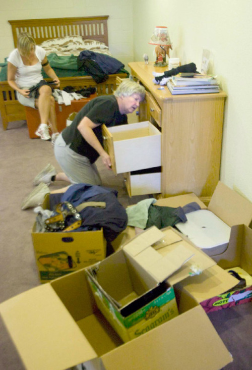 Paul Fraughton  |  The Salt Lake Tribune&#xA;Mary Paulsen with the help of her daughter Jenny Christensen   unpack clothing  and move  furniture  into Philip 's new bedroom at the Utah State Developmental Center in American Fork   Wednesday, August 25, 2010