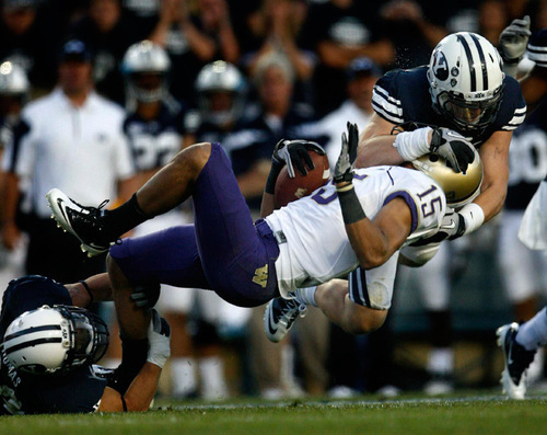 Trent Nelson  |  The Salt Lake Tribune
Washington's Jermaine Kearse is hit by BYU's Andrew Rich, right, and Steven Thomas at Lavell Edwards Stadium in Provo, Saturday, September 4, 2010.