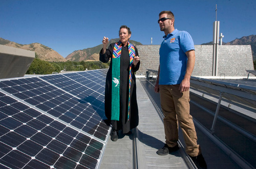 Al Hartmann  |  Salt Lake Tribune
Reverend Dr. Marti Zimmerman, left, the senior pastor at Christ United Methodist Church at 2374 East 3300 South questions electrician and installer Jason Allen of Alpenglow Solar about the church's new array of rooftop solar panels that are now up and running.   The church got funding from Rocky Mountain Power's Blue Sky renewable-energy program.  It's estimated the new panels will supply 20 to 30 per cent of the church's electrical needs.