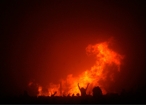 Rick Egan   |  The Salt Lake Tribune&#xA;&#xA;Burners dance around the huge fire after the Burning Man toppled to the ground, Friday, Sept. 3, 2010.
