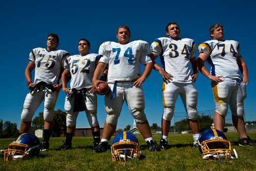 Chris Detrick  |  The Salt Lake Tribune &#xA;Cyprus offensive line (L-R) Trent White, Dylan Monson, Max Cone, Bryan Edwards and Jason Fracchia pose for a portrait during a practice at Cyprus High School Tuesday September 7, 2010.