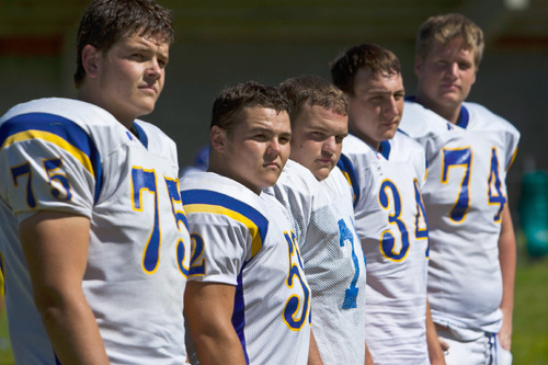 Chris Detrick  |  The Salt Lake Tribune &#xA;Cyprus offensive line (L-R) Trent White, Dylan Monson, Max Cone, Bryan Edwards and Jason Fracchia pose for a portrait during a practice at Cyprus High School Tuesday September 7, 2010.