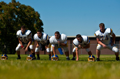 Chris Detrick  |  The Salt Lake Tribune &#xA;Cyprus offensive line (L-R) Trent White, Dylan Monson, Max Cone, Bryan Edwards and Jason Fracchia pose for a portrait during a practice at Cyprus High School Tuesday September 7, 2010.