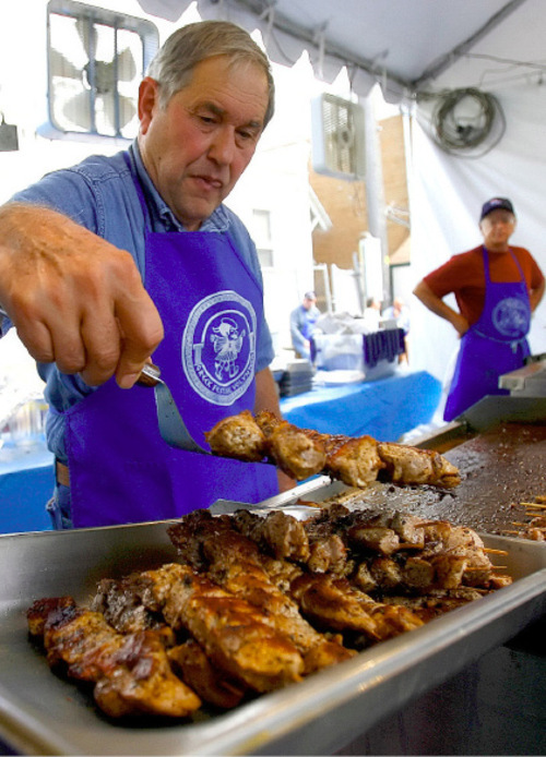 File  |  The Salt Lake Tribune
Demetri Kourtides serves up souvlaki during the Greek Festival in Salt Lake City in 2006.