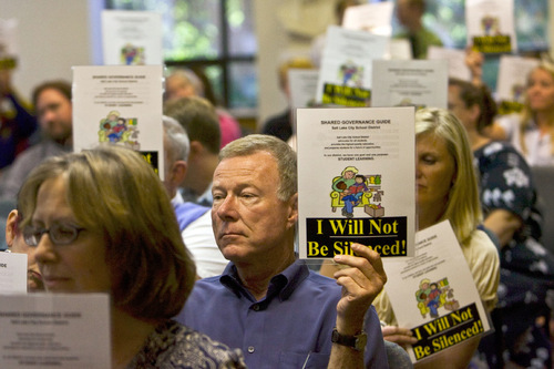 Chris Detrick  |  The Salt Lake Tribune &#xA;Supporter John Bach holds a sign reading 'I Will Not Be Silenced!' during a Salt Lake City School District board meeting Tuesday September 7, 2010. Last month, the school board modified the high-school block schedule. The Salt Lake Teachers Association says the decision was made without 
