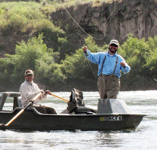 Francisco Kjolseth  |  The Salt Lake Tribune

Bruce Smitthammer of Victor, Idaho, mans the oars as Tribune reporter Brett Prettyman casts his line while floating the South Fork of the Snake River recently in Idaho.