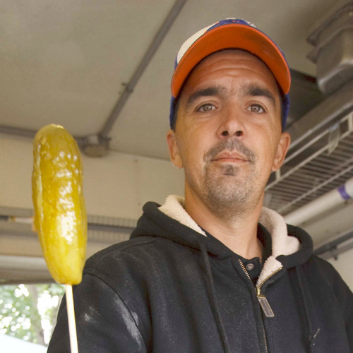 Trent Nelson  |  The Salt Lake Tribune&#xA; How to consume 6,000 calories without trying? 1. Start with a pickle on a stick. Kevin Larose demonstrates the process of creating a deep-fried pickle at the Utah State Fair Thursday, Sept. 9, 2010 in Salt Lake City.