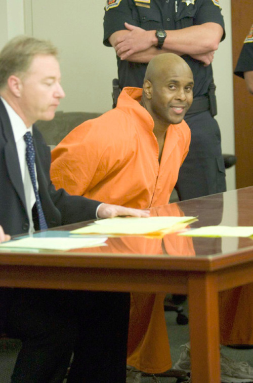 Azien Marchet flashes a smile as he sits at the defense table for his sentencing  on  Friday, July 16,2010  photo:Paul Fraughton/ The Salt Lake Tribune