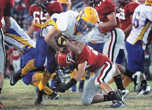 Scott Sommerdorf  l  The Salt Lake Tribune&#xA;San Juan RB Ryan Lyman (21) runs the ball over the goal line for the Broncos' third TD of the first half before being brought down by Grantsville's Lincoln Kelley (85). The TD made the score 18-0 San Juan. The 2A San Juan Broncos beat the 3A Grantsville Cowboys 18-7, Friday, September 10, 2010.