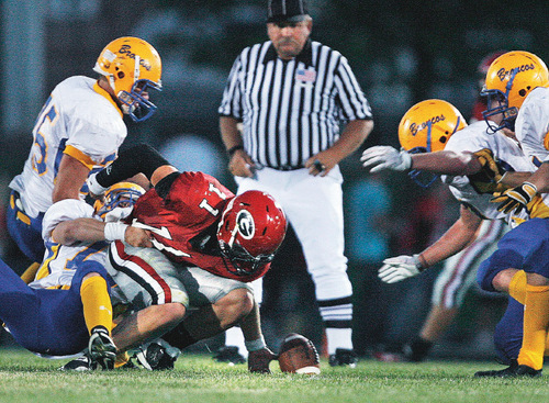 Scott Sommerdorf  l  The Salt Lake Tribune&#xA;Grantsville QB Bridger Bowman (11) fumbled the ball deep in San Juan territory late in the first half, and did not score. The 2A San Juan Broncos beat the 3A Grantsville Cowboys 18-7, Friday, September 10, 2010.