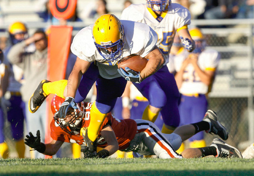 Scott Sommerdorf  l  The Salt Lake Tribune&#xA;San Juan RB Ryan Lyman (21) is tackled after a long gain by Grantsville's DB Lincoln Kelley (85) during first half play. The 2A San Juan Broncos beat the 3A Grantsville Cowboys 18-7, Friday, September 10, 2010.