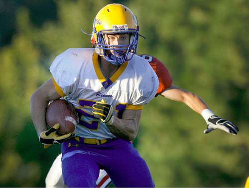 Scott Sommerdorf  l  The Salt Lake Tribune&#xA;San Juan's RB Ryan Lyman (21) runs the ball against Grantsville during first half play. The 2A San Juan Broncos beat the 3A Grantsville Cowboys 18-7, Friday, September 10, 2010.