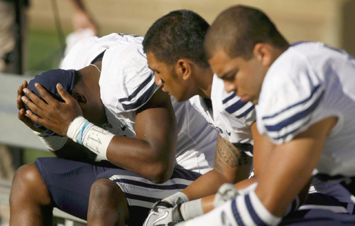 Trent Nelson  |  The Salt Lake Tribune&#xA;BYU's O'Neill Chambers (left) with his head in his hands on the bench in the fourth quarter as BYU faces Air Force at the Air Force Academy, college football Saturday, September 11, 2010. Air Force wins 35-14.