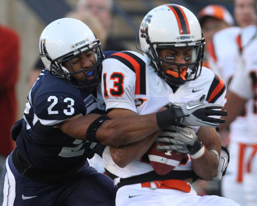 Rick Egan   |  The Salt Lake Tribune
Curtis Marsh tackles Rodrick Rumble, (13) Idaho State, as he hauls in a pass, in football action,  Utah State vs. Idaho State football game, Saturday, September 11, 2010.