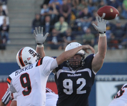 Rick Egan   |  The Salt Lake Tribune&#xA;&#xA;Casey Davis (92) tries to get his hand on a pass by Kyle Morris, Idaho State, in football action,  Utah State vs. Idaho State football game, Saturday, September 11, 2010.