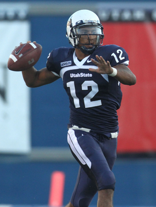 Rick Egan   |  The Salt Lake Tribune&#xA;&#xA;QB Diondre Borel (12) throws the ball for the Aggies, in football action,  Utah State vs. Idaho State football game, Saturday, September 11, 2010.