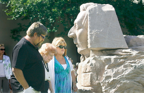 Scott Sommerdorf  l  The Salt Lake Tribune&#xA;&#xA;Hortense Smith, 91, center, arrives Sunday at Gilgal Gardens escorted by T.R. Child, left, and Debbie Child, right, as they pass by the Sphinx with Joseph's Smith's face. Gilgal's creator, Thomas B. Child was Hortense's father-in-law. The Gilgal Garden is celebrating its 10th anniversary as a Salt Lake City public park.