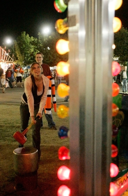 Salt Lake Tribune Archives

Tim Goble and Kea Doppel take a shot at the High Striker at the 2005 Utah State Fair.