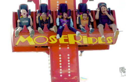 Salt Lake Tribune Archives

Children react at they drop down on a ride at the 2002 Utah State Fair.