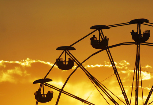 Salt Lake Tribune Archives

The ferris wheel is silhouetted against the sunset at the Utah State Fair of 2001.