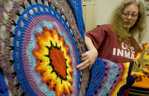 Jim Urquhart  |  The Salt Lake Tribune
Carole Alden talks to other inmates about a crochet piece she is working on in February at the Utah State Prison in Draper. Carole Alden, a recognized Utah artist, is serving a 1 to 15 year sentence for manslaughter. She has continued creating while serving her time but has changed the mediums from sculpture types to crocheting, drawing and painting.