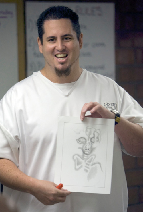Steve Griffin  |  The Salt Lake Tribune&#xA; &#xA;Inmate art instructor Bret Lindeman shows the class an example of his work during art class at the Utah State Prison in Riverton Tuesday, September 7, 2010.