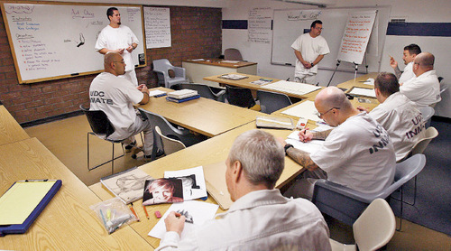 Steve Griffin  |  The Salt Lake Tribune&#xA;Inmate students and teachers work together Tuesday during an art class at the Utah State Prison in Riverton.