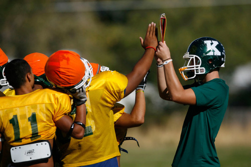 Francisco Kjolseth  |  The Salt Lake Tribune&#xA;Players gather for their next play as the the young Kearns team, led by quarterback J.R. Finai, are off to another solid start as the team practices on their field in Kearns.&#xA;Kearns, Sept. 13, 2010.