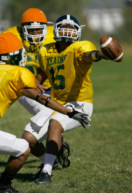 Francisco Kjolseth  |  The Salt Lake Tribune
The young Kearns team, led by quarterback J.R. Finai, center, are off to another solid start as the team practices on their field in Kearns.