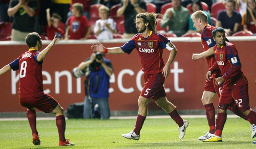 Steve Griffin  |  The Salt Lake Tribune
 
Real Salt Lake's Kyle Beckerman gets congratulated by his teammates after scoring on a header in first half action of the Real Salt Lake versus Toronto FC soccer game at Rio Tinto Stadium in Sandy Wednesday, September 15, 2010.